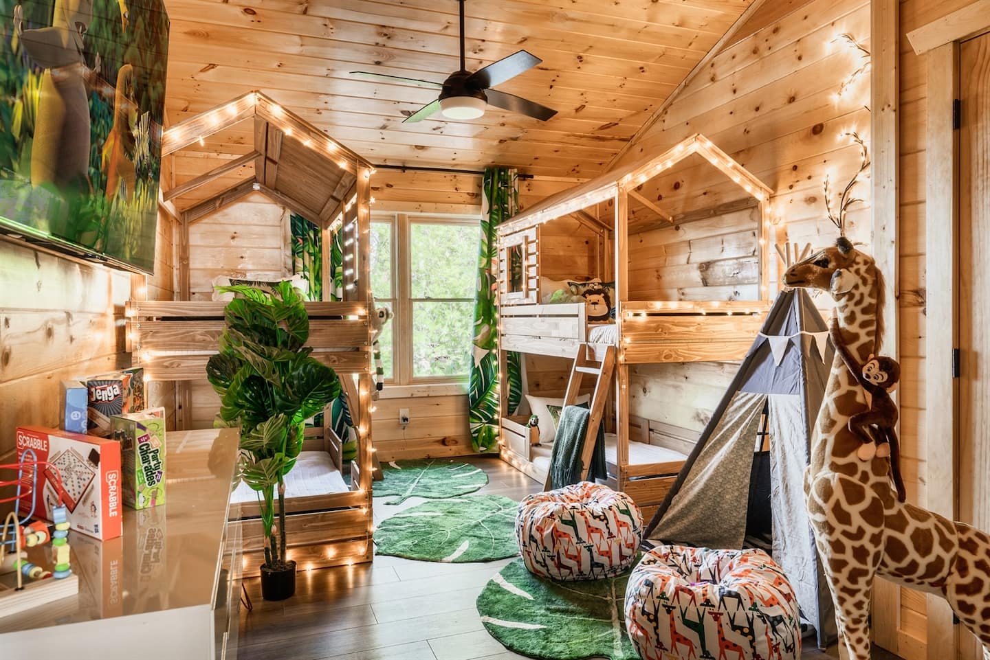 A cozy children's room featuring two bunk beds, playful decor, and colorful rugs. Soft lighting enhances the wooden interior, creating a warm and inviting atmosphere.